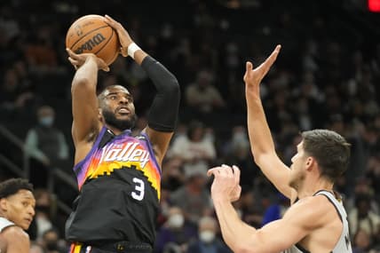 Jan 30, 2022; Phoenix, Arizona, USA; Phoenix Suns guard Chris Paul (3) shoots over San Antonio Spurs forward Doug McDermott (17) in the first half at Footprint Center. Mandatory Credit: Rick Scuteri-USA TODAY Sports