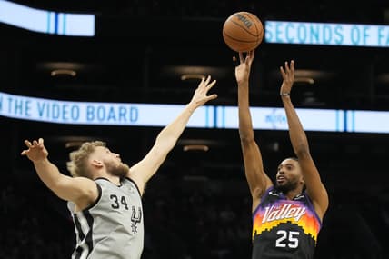 Jan 30, 2022; Phoenix, Arizona, USA; Phoenix Suns forward Mikal Bridges (25) shoots over San Antonio Spurs center Jock Landale (34) in the first half at Footprint Center. Mandatory Credit: Rick Scuteri-USA TODAY Sports