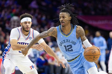 Jan 31, 2022; Philadelphia, Pennsylvania, USA; Memphis Grizzlies guard Ja Morant (12) dribbles the ball in front of Philadelphia 76ers guard Seth Curry (31) during the first quarter at Wells Fargo Center. Mandatory Credit: Bill Streicher-USA TODAY Sports