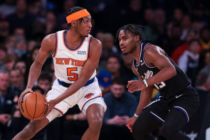 Jan 31, 2022; New York, New York, USA; New York Knicks guard Immanuel Quickley (5) shields the ball from Sacramento Kings guard Davion Mitchell (15) during the first half at Madison Square Garden. Mandatory Credit: Vincent Carchietta-USA TODAY Sports
