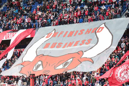 Mar 16, 2019; Harrison, NJ, USA; New York Red Bulls fans unveil a banner that reads "Unfinished Business"  before the game against the San Jose Earthquakes at Red Bull Arena. Mandatory Credit: Vincent Carchietta-USA TODAY Sports