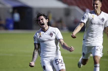 Sep 12, 2020; Sandy, Utah, USA; Colorado Rapids midfielder Braian Galvan (52) celebrates his second half goal with midfielder Cole Bassett (26) against the Real Salt Lake at Rio Tinto Stadium. Mandatory Credit: Jeffrey Swinger-USA TODAY Sports
