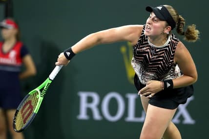 Jelena Ostapenko serves to Victoria Azarenka in their semifinal match at the BNP Paribas in Indian Wells, Calif., on October 15, 2021.

Azarenka Vs Ostapenko Bnp Paribas2163