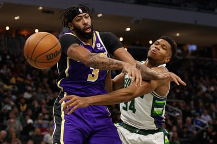 Nov 17, 2021; Milwaukee, Wisconsin, USA;  Los Angeles Lakers forward Anthony Davis (3) and Milwaukee Bucks forward Giannis Antetokounmpo (34) battle for a rebound during the third quarter at Fiserv Forum. Mandatory Credit: Jeff Hanisch-USA TODAY Sports