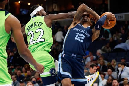 Nov 8, 2021; Memphis, Tennessee, USA; Minnesota Timberwolves guard Patrick Beverley (22) blocks the shot of Memphis Grizzles guard Ja Morant (12) during the second half at FedExForum. Mandatory Credit: Petre Thomas-USA TODAY Sports