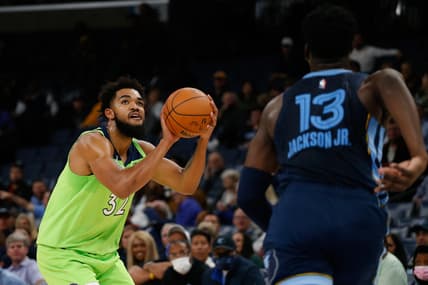 Nov 8, 2021; Memphis, Tennessee, USA; Minnesota Timberwolves center/forward Karl-Anthony Towns (32) shoots for three during the first half against the Memphis Grizzles at FedExForum. Mandatory Credit: Petre Thomas-USA TODAY Sports
