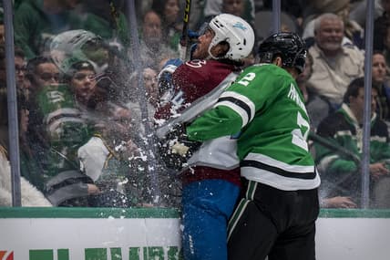 Nov 26, 2021; Dallas, Texas, USA; Dallas Stars defenseman Jani Hakanpaa (2) checks Colorado Avalanche left wing Kiefer Sherwood (44) during the third period at the American Airlines Center. Mandatory Credit: Jerome Miron-USA TODAY Sports