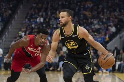 December 8, 2021; San Francisco, California, USA; Golden State Warriors guard Stephen Curry (30) dribbles the basketball against Portland Trail Blazers guard Dennis Smith Jr. (10) during the first quarter at Chase Center. Mandatory Credit: Kyle Terada-USA TODAY Sports