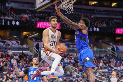 Dec 23, 2021; Orlando, Florida, USA; New Orleans Pelicans guard Tomas Satoransky (31) goes to the basket against Orlando Magic forward Admiral Schofield (25) during the second half at Amway Center. Mandatory Credit: Mike Watters-USA TODAY Sports
