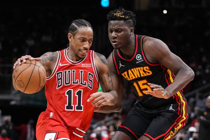 Dec 27, 2021; Atlanta, Georgia, USA; Chicago Bulls forward DeMar DeRozan (11) dribbles against Atlanta Hawks center Clint Capela (15) during the second half at State Farm Arena. Mandatory Credit: Dale Zanine-USA TODAY Sports