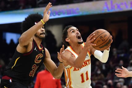 Dec 31, 2021; Cleveland, Ohio, USA; Atlanta Hawks guard Trae Young (11) drives to the basket against Cleveland Cavaliers center Jarrett Allen (31) during the first half at Rocket Mortgage FieldHouse. Mandatory Credit: Ken Blaze-USA TODAY Sports