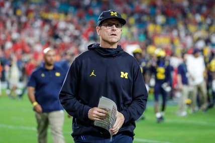 Michigan head coach Jim Harbaugh walks off the field after the Wolverines' 34-11 loss to the Georgia Bulldogs in the Orange Bowl.Syndication Detroit Free Press
