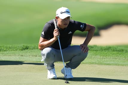 January 8, 2022; Maui, Hawaii, USA; Collin Morikawa lines up his putt on the 13th hole during the third round of the Sentry Tournament of Champions golf tournament at Kapalua Resort - The Plantation Course. Mandatory Credit: Kyle Terada-USA TODAY Sports