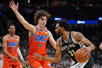 Jan 19, 2022; San Antonio, Texas, USA;  San Antonio Spurs forward Keita Bates-Diop (31) dribbles against Oklahoma City Thunder guard Josh Giddey (3) in the first half at the AT&T Center. Mandatory Credit: Daniel Dunn-USA TODAY Sports
