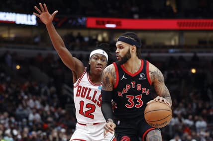 Jan 26, 2022; Chicago, Illinois, USA; Toronto Raptors guard Gary Trent Jr. (33) drives to the basket against Chicago Bulls guard Ayo Dosunmu (12) during the second half at United Center. Mandatory Credit: Kamil Krzaczynski-USA TODAY Sports