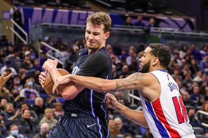 Jan 28, 2022; Orlando, Florida, USA; Orlando Magic forward Franz Wagner (22) and Detroit Pistons guard Cory Joseph (18) battle for the rebound during the second quarter at Amway Center. Mandatory Credit: Mike Watters-USA TODAY Sports