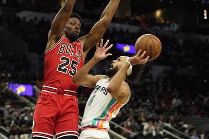 Jan 28, 2022; San Antonio, Texas, USA; San Antonio Spurs guard Derrick White (4) shoots over Chicago Bulls forward Tyler Cook (25) during the second half at ATT Center. Mandatory Credit: Scott Wachter-USA TODAY Sports