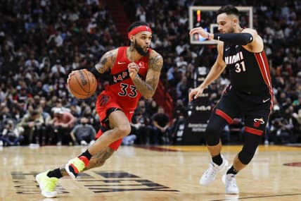 Jan 29, 2022; Miami, Florida, USA; Toronto Raptors guard Gary Trent Jr. (33) dribbles the basketball as Miami Heat guard Max Strus (31) defends during the third quarter at FTX Arena. Mandatory Credit: Sam Navarro-USA TODAY Sports