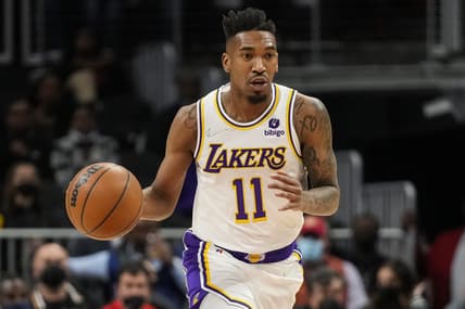 Jan 30, 2022; Atlanta, Georgia, USA; Los Angeles Lakers guard Malik Monk (11) brings the ball up the court against the Atlanta Hawks during the first half at State Farm Arena. Mandatory Credit: Dale Zanine-USA TODAY Sports