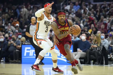 Jan 31, 2022; Cleveland, Ohio, USA; Cleveland Cavaliers guard Brandon Goodwin (00) drives beside New Orleans Pelicans guard Josh Hart (3) in the second quarter at Rocket Mortgage FieldHouse. Mandatory Credit: David Richard-USA TODAY Sports