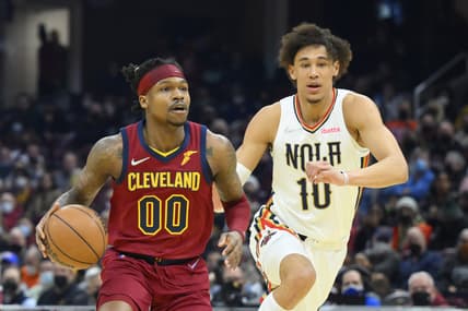 Jan 31, 2022; Cleveland, Ohio, USA; Cleveland Cavaliers guard Brandon Goodwin (00) drives beside New Orleans Pelicans center Jaxson Hayes (10) in the second quarter at Rocket Mortgage FieldHouse. Mandatory Credit: David Richard-USA TODAY Sports