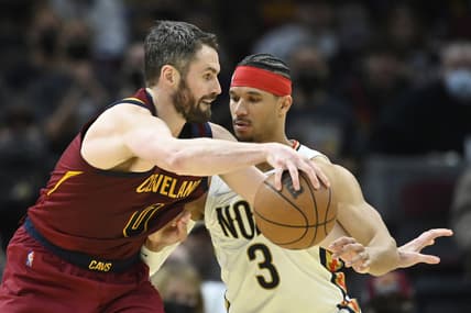 Jan 31, 2022; Cleveland, Ohio, USA; New Orleans Pelicans guard Josh Hart (3) defends Cleveland Cavaliers forward Kevin Love (0) in the fourth quarter at Rocket Mortgage FieldHouse. Mandatory Credit: David Richard-USA TODAY Sports