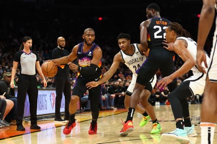 Feb 1, 2022; Phoenix, Arizona, USA; Phoenix Suns center Deandre Ayton (22) sets a pick on Brooklyn Nets guard Cam Thomas (24) as guard Chris Paul (3) dribbles the ball during the first half at Footprint Center. Mandatory Credit: Mark J. Rebilas-USA TODAY Sports