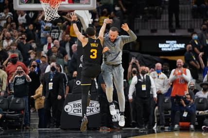 Feb 1, 2022; San Antonio, Texas, USA;  Golden State Warriors guard Jordan Poole (3) and guard Stephen Curry (30) celebrate Poole's three-point shot late in the second half against the San Antonio Spurs at the AT&T Center. Mandatory Credit: Daniel Dunn-USA TODAY Sports