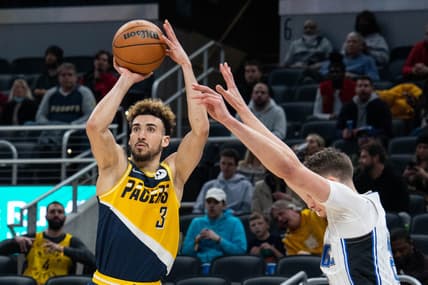 Feb 2, 2022; Indianapolis, Indiana, USA; Indiana Pacers guard Chris Duarte (3) shoots the ball while Orlando Magic center Moritz Wagner (21) defends in the first half at Gainbridge Fieldhouse. Mandatory Credit: Trevor Ruszkowski-USA TODAY Sports
