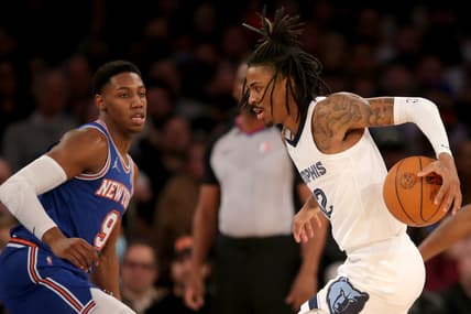 Feb 2, 2022; New York, New York, USA; Memphis Grizzlies guard Ja Morant (12) controls the ball against New York Knicks guard RJ Barrett (9) during the second quarter at Madison Square Garden. Mandatory Credit: Brad Penner-USA TODAY Sports