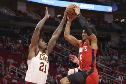 Feb 2, 2022; Houston, Texas, USA; Houston Rockets forward Kenyon Martin Jr. (6) drives against Cleveland Cavaliers center Ed Davis (21) in the second quarter at Toyota Center. Mandatory Credit: Thomas Shea-USA TODAY Sports