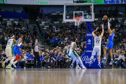 Feb 2, 2022; Dallas, Texas, USA; Oklahoma City Thunder forward Darius Bazley (7) shoots over Dallas Mavericks guard Luka Doncic (77) during the second quarter at the American Airlines Center. Mandatory Credit: Jerome Miron-USA TODAY Sports