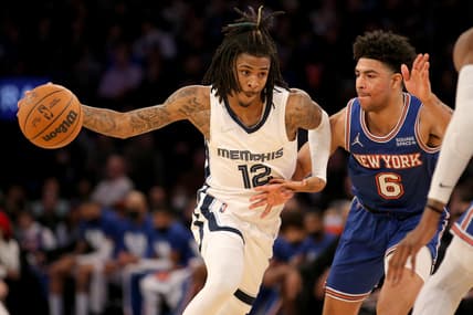 Feb 2, 2022; New York, New York, USA; Memphis Grizzlies guard Ja Morant (12) drives to the basket against New York Knicks guard Quentin Grimes (6) during the third quarter at Madison Square Garden. Mandatory Credit: Brad Penner-USA TODAY Sports
