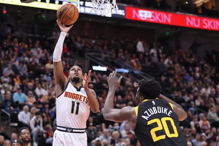 Feb 2, 2022; Salt Lake City, Utah, USA; Denver Nuggets guard Monte Morris (11) lays the ball up against Utah Jazz center Udoka Azubuike (20) in the first quarter at Vivint Arena. Mandatory Credit: Rob Gray-USA TODAY Sports