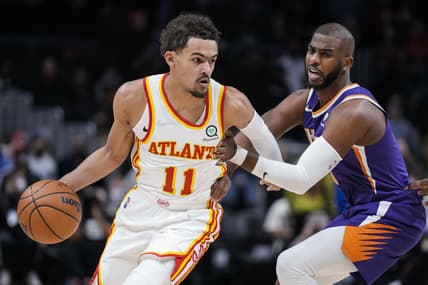 Feb 3, 2022; Atlanta, Georgia, USA; Atlanta Hawks guard Trae Young (11) dribbles against Phoenix Suns guard Chris Paul (3) during the first quarter at State Farm Arena. Mandatory Credit: Dale Zanine-USA TODAY Sports