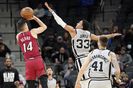 Feb 3, 2022; San Antonio, Texas, USA; Miami Heat guard Tyler Herro (14) shoots over San Antonio guard Tre Jones (33) during the first half at AT&T Center. Mandatory Credit: Scott Wachter-USA TODAY Sports
