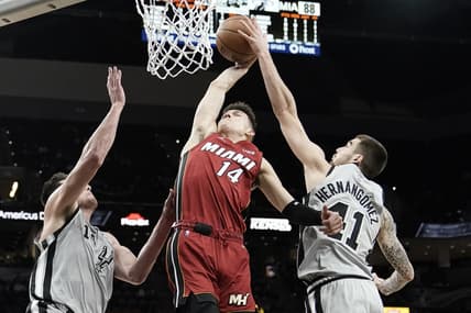 Feb 3, 2022; San Antonio, Texas, USA; San Antonio Spurs forward Juancho Hernangomez (41) blocks the dunk attempted by Miami Heat guard Tyler Herro (14) during the second half at AT&T Center. Mandatory Credit: Scott Wachter-USA TODAY Sports