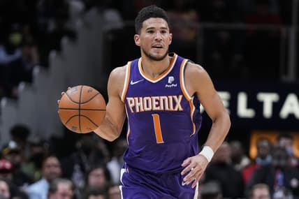 Feb 3, 2022; Atlanta, Georgia, USA; Phoenix Suns guard Devin Booker (1) brings the ball up the court against the Atlanta Hawks during the second half at State Farm Arena. Mandatory Credit: Dale Zanine-USA TODAY Sports