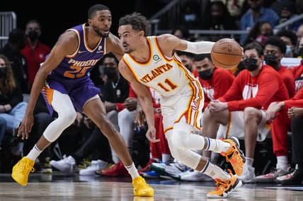Feb 3, 2022; Atlanta, Georgia, USA; Atlanta Hawks guard Trae Young (11) drives towards the basket against Phoenix Suns forward Mikal Bridges (25) during the second half at State Farm Arena. Mandatory Credit: Dale Zanine-USA TODAY Sports