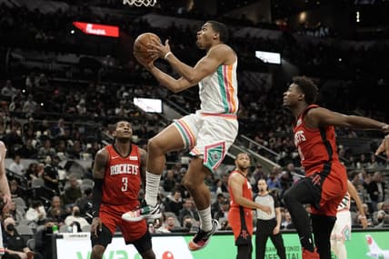 Feb 4, 2022; San Antonio, Texas, USA; San Antonio Spurs forward Keldon Johnson (3) drives to the basket past Houston Rockets forward Jae'Sean Tate (8) during the first half aat AT&T Center. Mandatory Credit: Scott Wachter-USA TODAY Sports