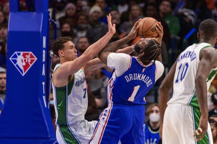 Feb 4, 2022; Dallas, Texas, USA; Dallas Mavericks center Dwight Powell (7) defends against Philadelphia 76ers center Andre Drummond (1) during the second quarter at the American Airlines Center. Mandatory Credit: Jerome Miron-USA TODAY Sports