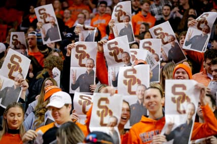 Oklahoma State fans hold up newspapers with a picture of former OU football coach Lincoln Riley during Oklahoma's introduction before a Bedlam basketball game between the University of Oklahoma Sooners (OU) and the Oklahoma State University Cowboys (OSU) at Gallagher-Iba Arena in Stillwater, Saturday, Feb. 5, 2022.

Bedlam Basketball