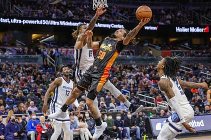Feb 5, 2022; Orlando, Florida, USA; Orlando Magic guard Cole Anthony (50) goes to the basket against Memphis Grizzlies forward Brandon Clarke (15) during the second quarter at Amway Center. Mandatory Credit: Mike Watters-USA TODAY Sports