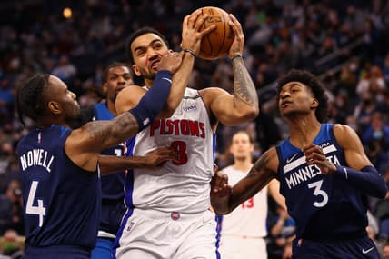 Feb 6, 2022; Minneapolis, Minnesota, USA; Detroit Pistons forward Trey Lyles (8) drives to the basket against Minnesota Timberwolves guard Jaylen Nowell (4) during the second quarter at Target Center. Mandatory Credit: Harrison Barden-USA TODAY Sports