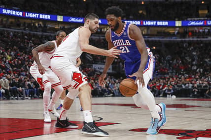 Feb 6, 2022; Chicago, Illinois, USA; Philadelphia 76ers center Joel Embiid (21) drives to the basket against Chicago Bulls center Nikola Vucevic (9) during the second half at United Center. Mandatory Credit: Kamil Krzaczynski-USA TODAY Sports