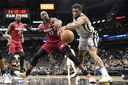 Feb 3, 2022; San Antonio, Texas, USA; Miami Heat center Bam Adebayo (13) and San Antonio Spurs forward Thaddeus Young (30) battle for a loose ball during the first half at AT&T Center. Mandatory Credit: Scott Wachter-USA TODAY Sports