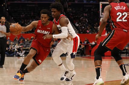 Feb 7, 2022; Washington, District of Columbia, USA; Miami Heat guard Kyle Lowry (7) drives to the basket as Washington Wizards guard Aaron Holiday (4) defends during the first quarter at Capital One Arena. Mandatory Credit: Geoff Burke-USA TODAY Sports