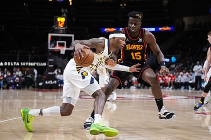 Feb 8, 2022; Atlanta, Georgia, USA; Indiana Pacers forward Torrey Craig (13) dribbles against Atlanta Hawks center Clint Capela (15) during the first half at State Farm Arena. Mandatory Credit: Dale Zanine-USA TODAY Sports