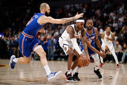 Feb 8, 2022; Denver, Colorado, USA; Denver Nuggets forward Will Barton (5) controls the ball under pressure from New York Knicks guard Evan Fournier (13) and guard Kemba Walker (8) in the first quarter at Ball Arena. Mandatory Credit: Isaiah J. Downing-USA TODAY Sports