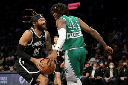 Feb 8, 2022; Brooklyn, New York, USA; Brooklyn Nets guard DeAndre' Bembry (95) drives to the basket against Boston Celtics center Robert Williams III (44) during the second quarter at Barclays Center. Mandatory Credit: Brad Penner-USA TODAY Sports